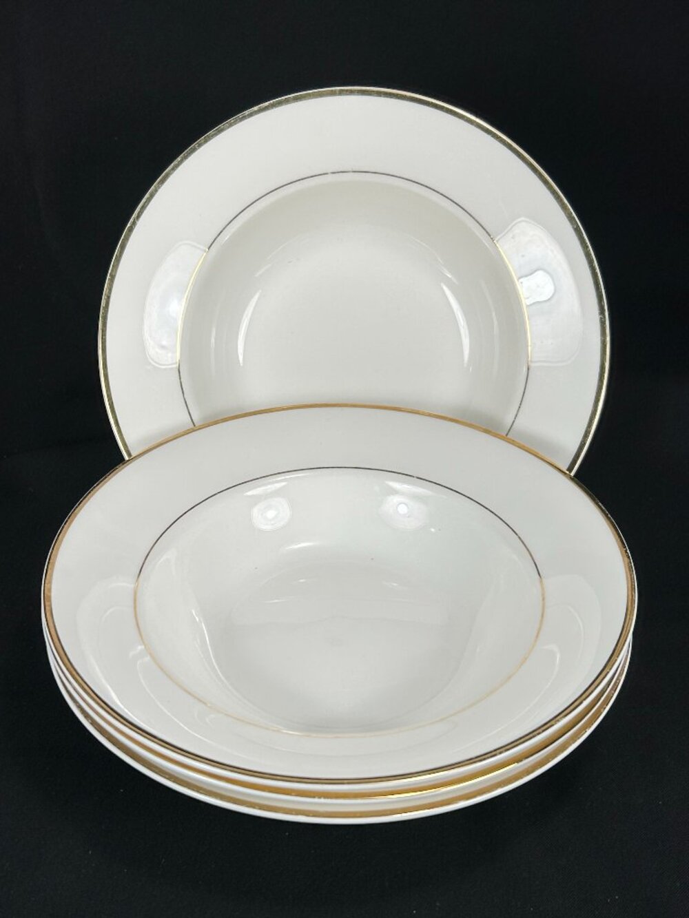 set of 4 rimmed soup bowls. Mikasa Cameo Gold